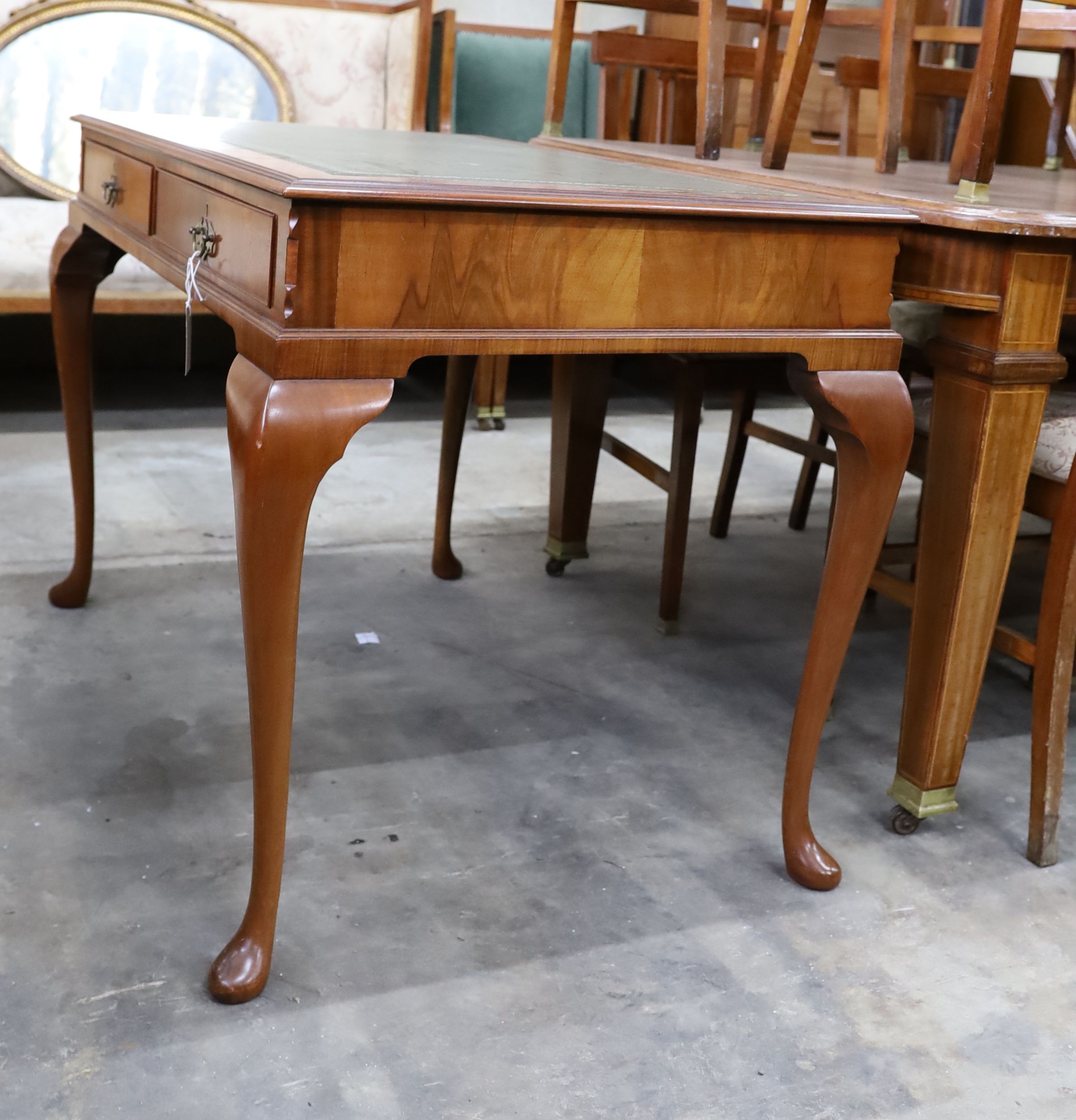 A reproduction George III style mahogany two drawer writing table, width 110cm, depth 72cm, height 77cm